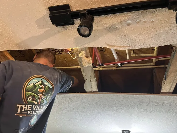 Ryan Chastain, founder and Master Plumber of The Village Plumber, working on a job in North Georgia